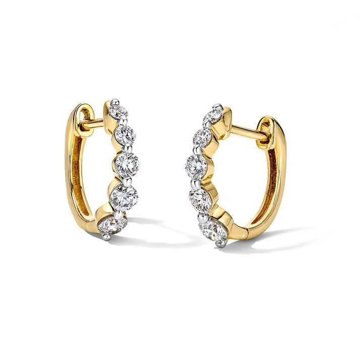 Shared Prong Graduated Diamond Huggie Earrings In Yellow Gold 14K