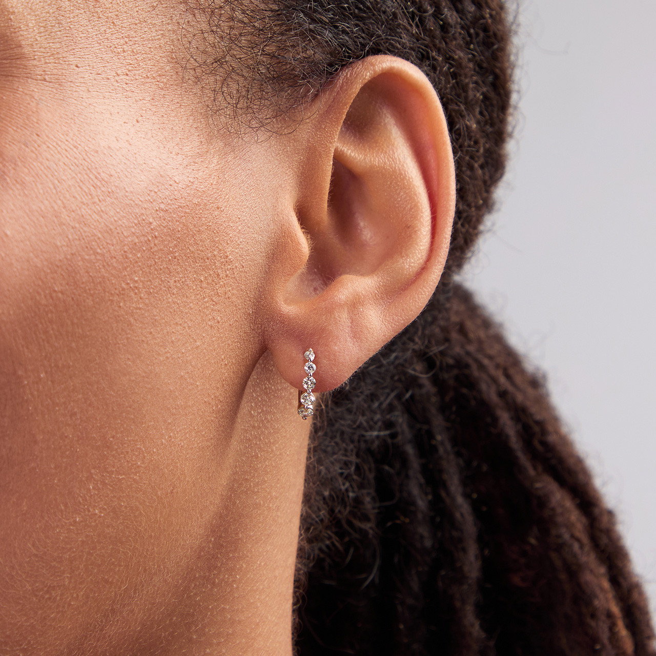 Shared Prong Graduated Diamond Huggie Earrings 1