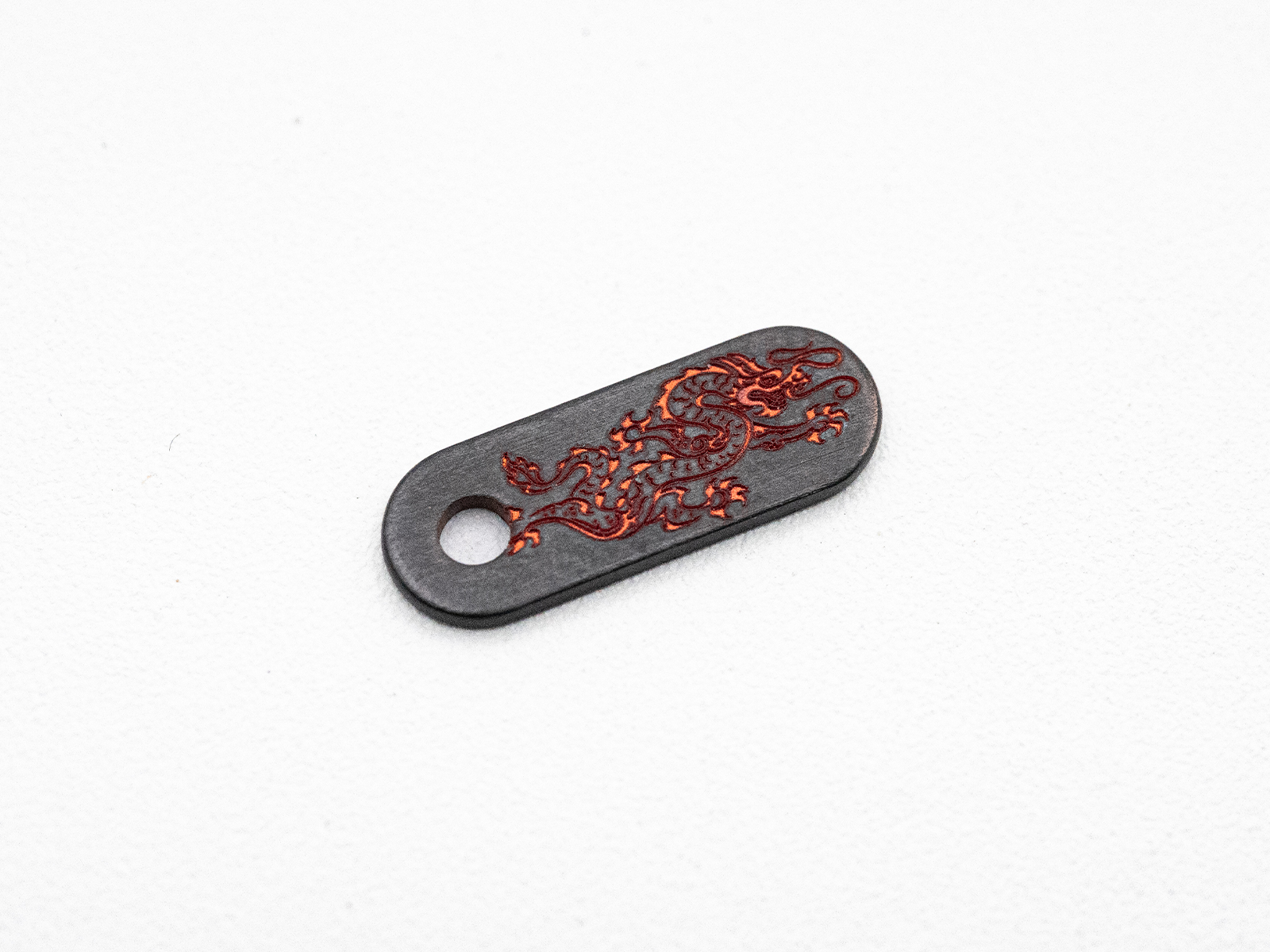 Hinderer Knives/Steel Flame Niobium Dragon Tab – Reversed Dragon - Copper Color Hinderer Knives/Steel Flame Niobium Dragon Tab – Reversed Dragon - Copper Color