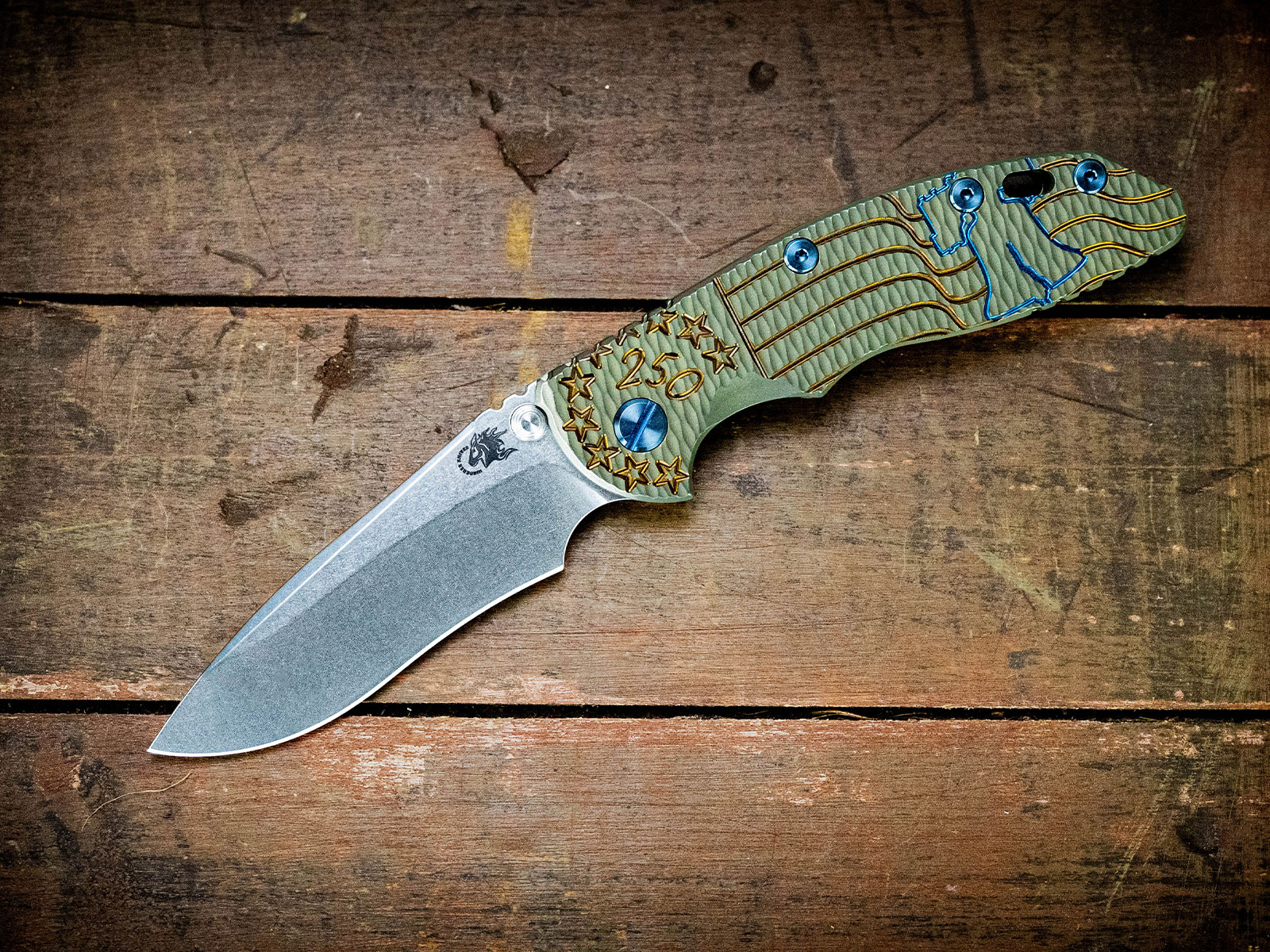 ExpProductCell_XM-18 3.5" Recurve-Non Flipper-Magnacut-Liberty Bell Textured Battle Green/Bronze/Blue-Blue Ti hardware ExpProductCell_XM-18 3.5" Recurve-Non Flipper-Magnacut-Liberty Bell Textured Battle Green/Bronze/Blue-Blue Ti hardware