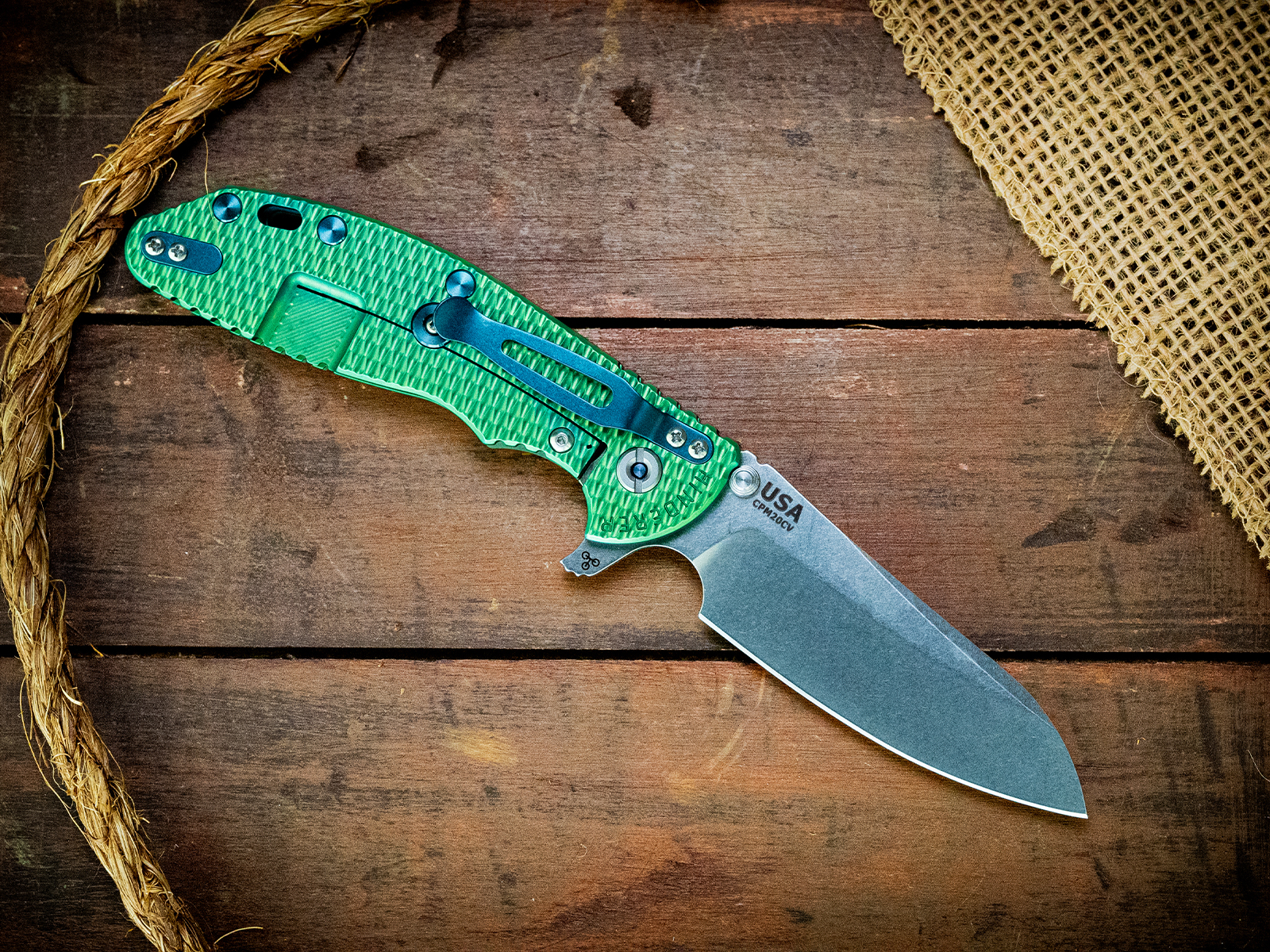 ExpProductCell_XM-24 Sheepsfoot-CPM20CV-Textured Bright Green-Translucent Green G10-Blue Ti Hardware