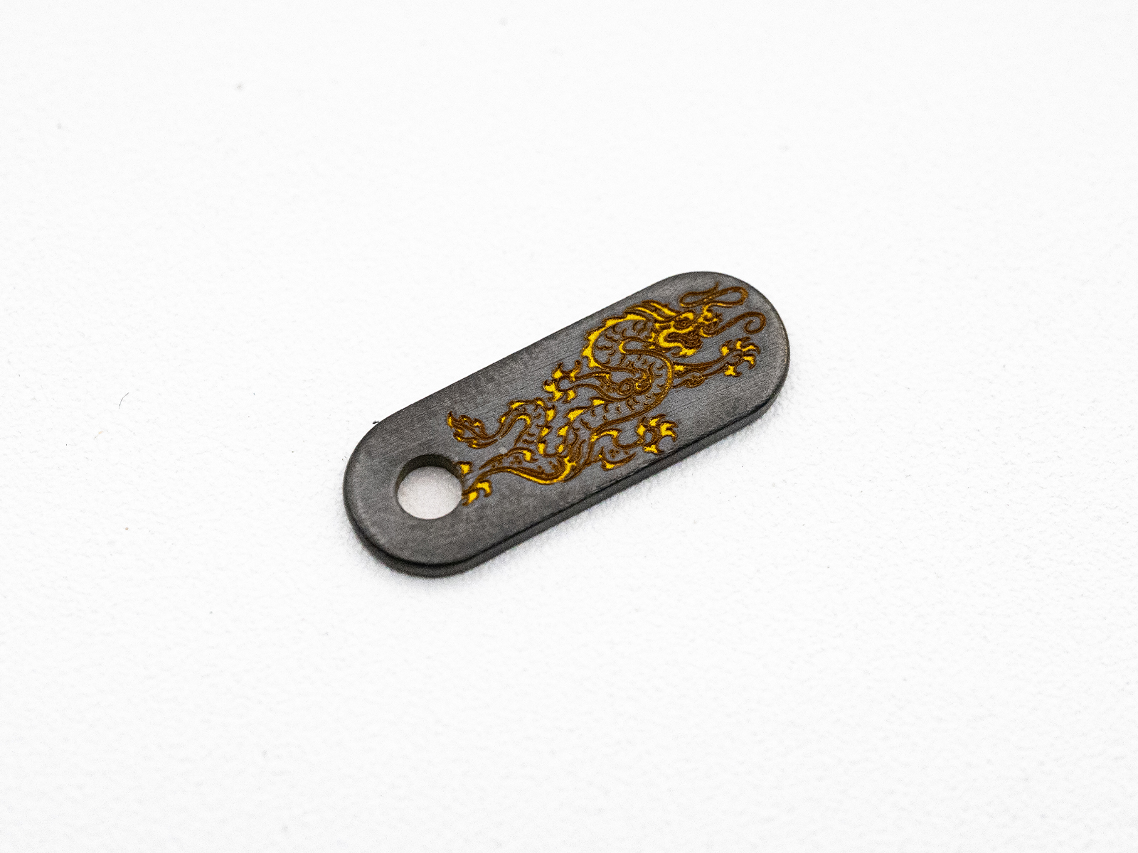 Hinderer Knives/Steel Flame Niobium Dragon Tab – Reversed Dragon - Yellow Hinderer Knives/Steel Flame Niobium Dragon Tab – Reversed Dragon - Yellow