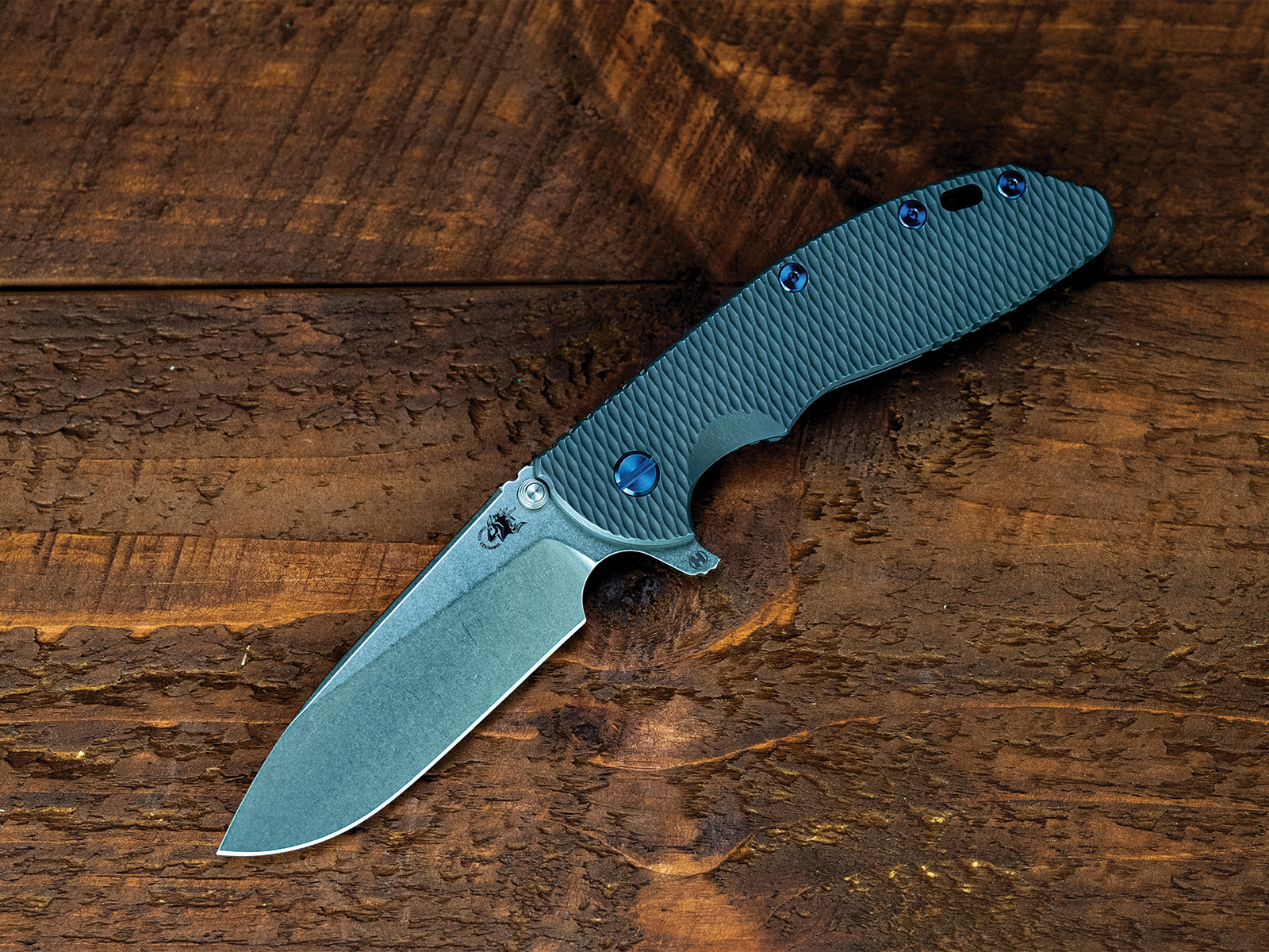 ExpProductCell_XM-24-S45VN-Slicer-Hollow Ground-Full Titanium-Special Ano-Blue Ti Hardware