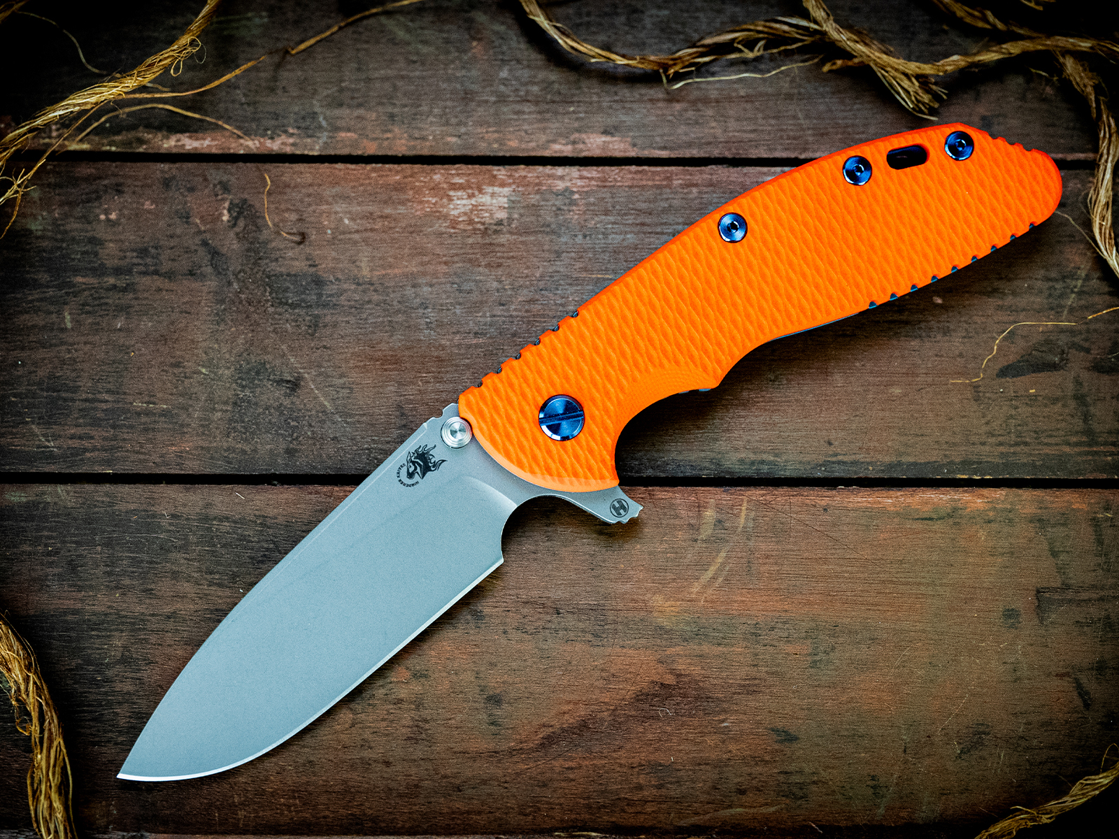 XM-24-S45VN-Slicer-Hollow Ground-Battle Blue-Orange G10-Blue Ti/Orange Stainless Standoffs Hardware XM-24-S45VN-Slicer-Hollow Ground-Battle Blue-Orange G10-Blue Ti/Orange Stainless Standoffs Hardware